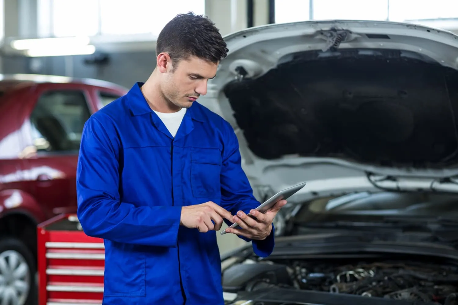 Mechanic checking vehicle diagnostics
