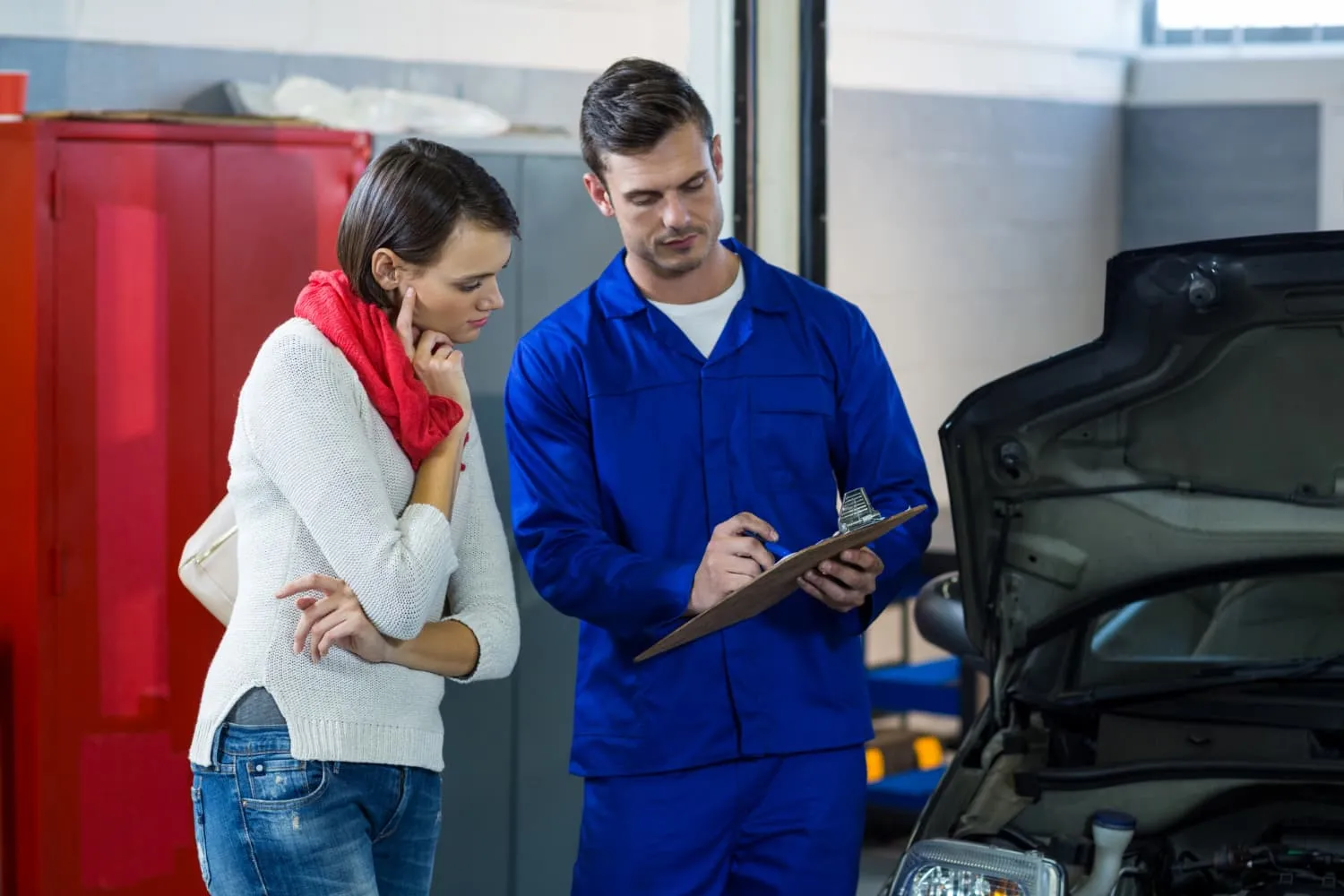 Mechanic discussing estimate with customer